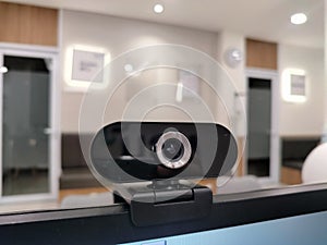 a computer or laptop webcam that is attached to the computer screen