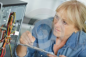 computer maintenance woman with notes