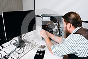 Computer master disassembling CPU with tools