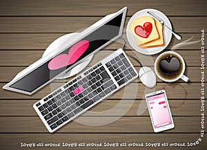 Computer and mobile phone with coffee and sliced bread