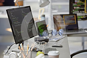 Computer Monitor with Code Lines in Office Setup