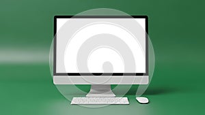 Computer monitor with keyboard and mouse on green background
