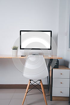 Computer monitor with white blank screen on the business desk