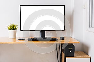 Computer monitor with white blank screen on the business desk