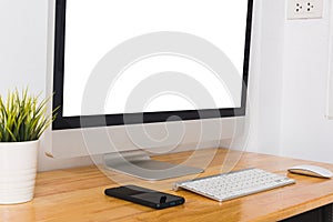 Computer monitor with white blank screen on the business desk