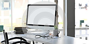 Computer monitor with white blank screen putting on doctor working desk together.