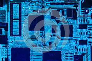 Computer motherboard chips closeup glowing