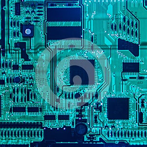 Computer motherboard chips closeup glowing