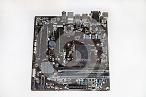 Computer motherboard with microcircuits capacitors resistors loops isolated on a white background, repair of equipment telephony