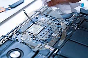 Computer motherboard. Pc technician repair service with laptop on hardware technology background. Maintenance engineer