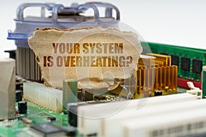 On the computer motherboard there is a cardboard with the inscription - Your system is overheating