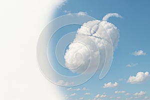 A computer mouse from a cloud in a blue sky. Space for text.