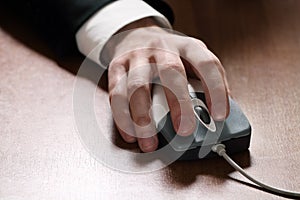 Computer mouse in hand businessman