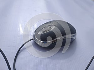 a computer mouse is a hand-held pointing device