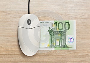 Computer mouse and one hundred euro banknote