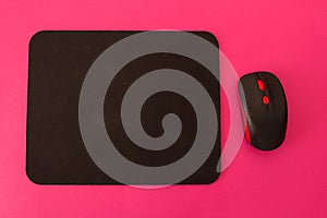 Computer mouse and mouse on a pink background, space