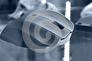 Computer mouse printed printed on 3d printer from powder close-up.