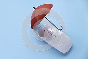 Computer and network security concept. Red umbrella over a computer mouse