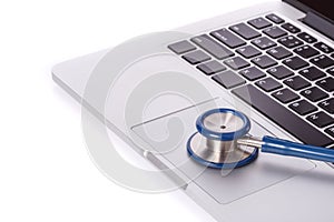 Computer notebook or laptop and stethoscope. Checking virus or d