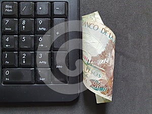 computer numeric keypad and Colombian money