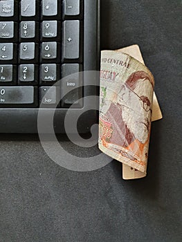 computer numeric keypad and uruguayan money photo