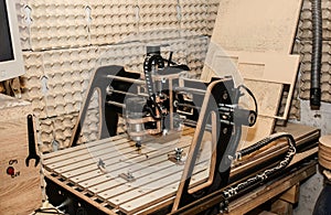 Computer numerical control machine for wooden tools. CNC equipment for maintenance control and details