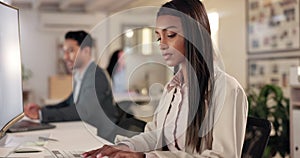 Computer, office and business woman at night working on project, writing email and proposal at desk. Corporate