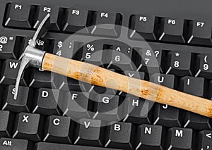 Computer and pickaxe - bitcoins mining