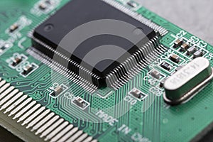 Computer processor chip on a circuit board with microchips and other electronic parts CPU Chip on Motherboard