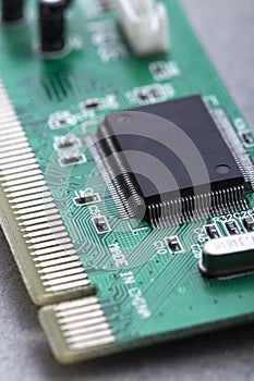 Computer processor chip on a circuit board with microchips and other electronic parts CPU Chip on Motherboard