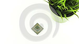 Computer Processor Chip Next To Green Grass