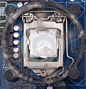 Computer processor on the motherboard is covered with dust. Need