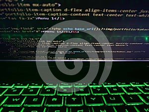 a computer program code that is often used. Computer language source code in the laptop with flashing keyboard or illuminated