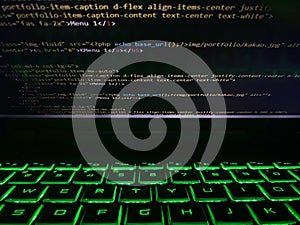 a computer program code that is often used. Computer language source code in the laptop with flashing keyboard or illuminated