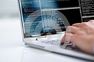 Computer Programmer Using Development Software