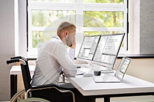 Computer Programmer Writing Program Code On Computer