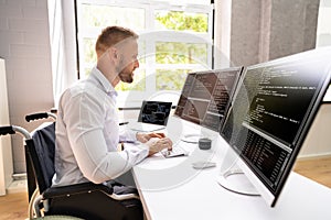 Computer Programmer Writing Program Code On Computer
