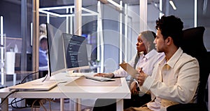Computer Programmer Writing Program Code On Computer