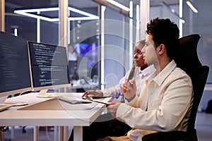 Computer Programmer Writing Program Code On Computer
