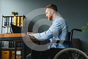 Computer Programmer Writing Program Code On Computer In Office.