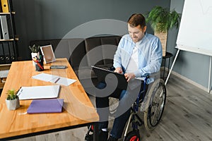 Computer Programmer Writing Program Code On Computer In Office