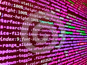Computer programming source code. Programmer working in computer screen. Software developer programming code. Database bits access