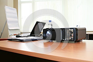 Computer projector and laptop in boardroom