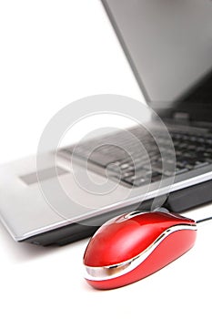 Computer and red mouse