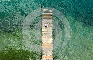 Computer Remote Work on Wooden Pier Aerial photo