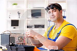 The computer repair technician repairing hardware