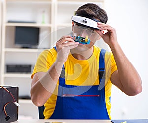 Computer repair technician repairing hardware