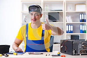 The computer repair technician repairing hardware