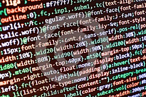 Website HTML Code on the Laptop Display