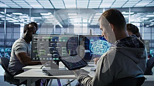 Technician inspects rackmounts in server room using artificial intelligence tech
